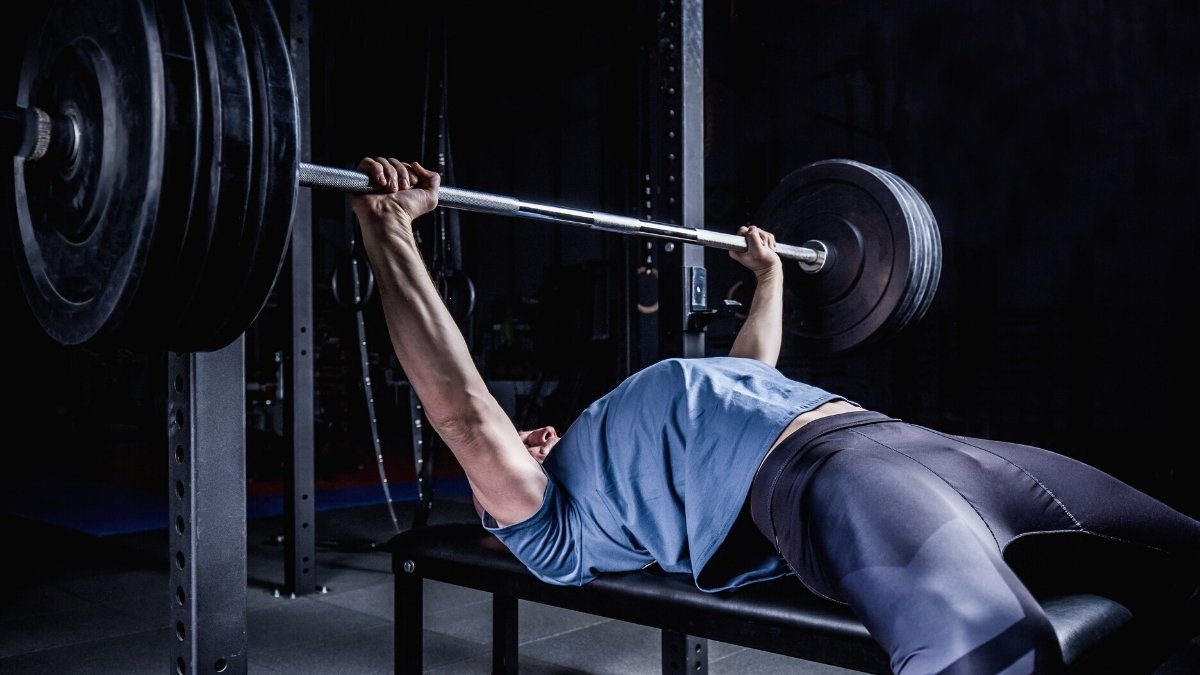 Floor Press Vs. Bench Press — Is One Better Than the Other? | BarBend